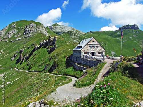 The mountain hut Pfälzerhütte (Pfaelzerhuette or Pfalzerhutte) in the Naaftal Valley and in the Liechtenstein Alps mountain massiv (Berghütte Pfälzerhütte auf dem Bettlerjoch) - Malbun, Liechtenstein photo