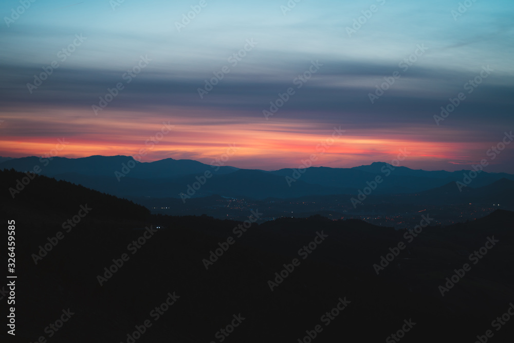 Silhouettes of Basque countryside at dusk