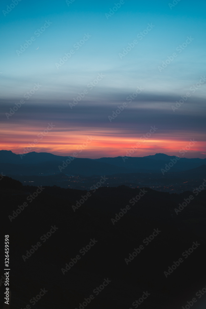 Silhouettes of Basque countryside at dusk