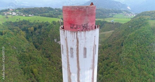 A close up shot of graffiti at the top of a chimney. photo