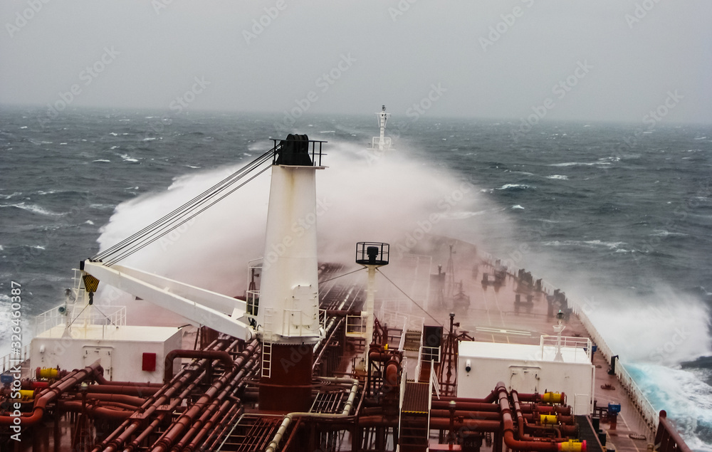Fotografie A storm wave breaks on board a tanker