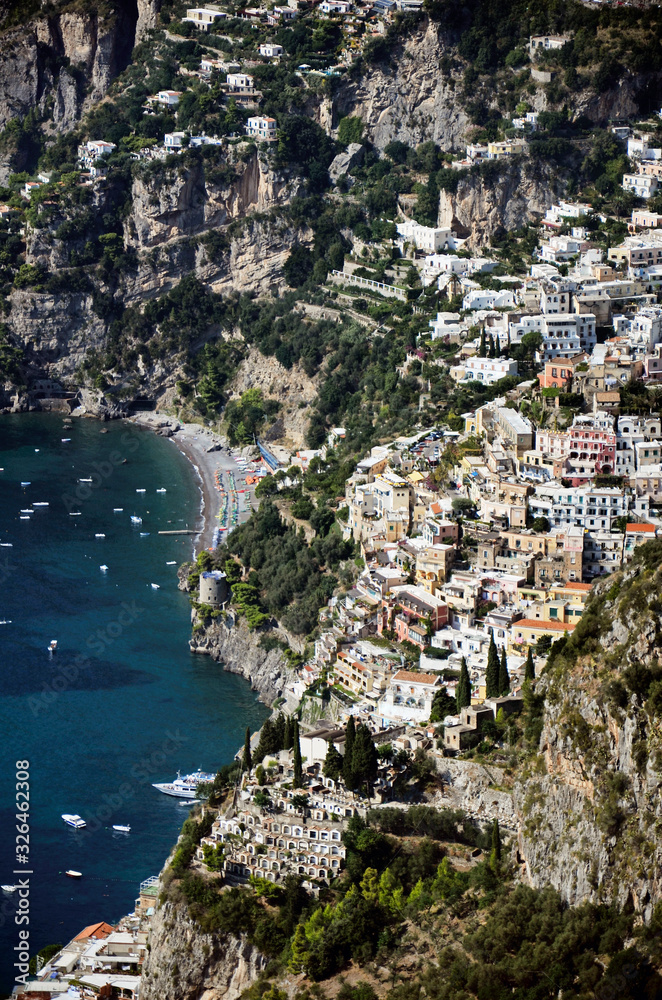 Positano. Panoramic view of the large beach and the village that climbs the hill