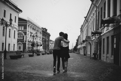 Hugging loving boy and girl outside