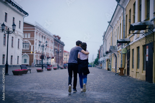 Hugging loving boy and girl outside