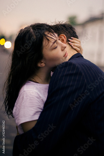 Hugging loving boy and girl outside