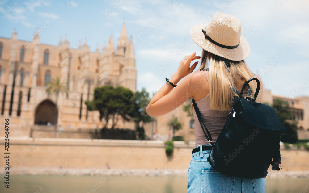 Rome Europe Italia travel summer tourism holiday vacation background - young girl with hat mobile phone and using action camera backpack in hand standing on the hill looking on the cathedral old city