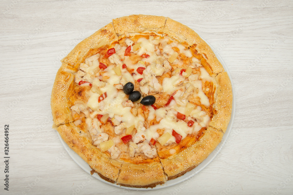 Hawaiian Pizza isolated on a white background Hawaiian Pizza isolated on a white background