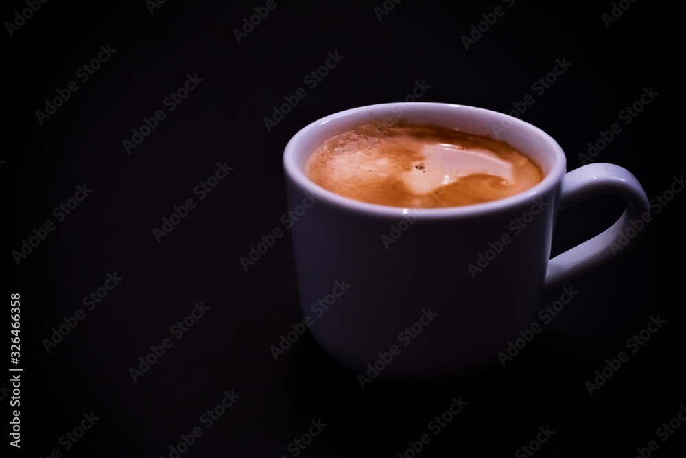 Cup of coffee on black background Cup of coffee on black background