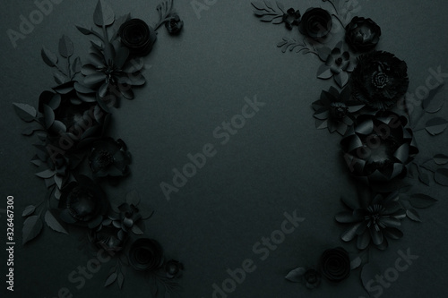 Black paper flowers on Black background. Cut from paper.