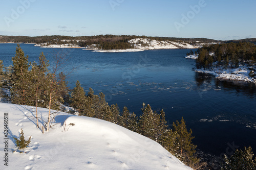 Ladoga Lake skerries in winter sunny day