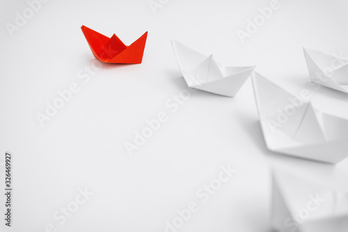 Leadership. Unique Paper Boat Leading The Rest.