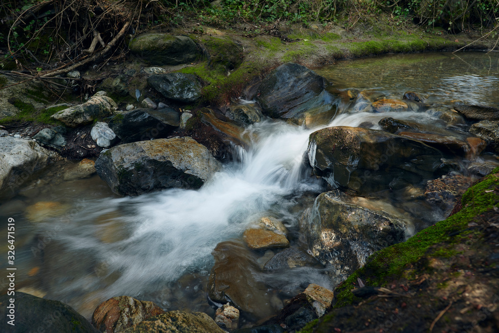 Long exposure photograph of the water in the Monachil River, in Los Cahorros. Monachil, Granada, Spain. Long exposure photograph of the water in the Monachil River, in Los Cahorros. Monachil, Granada, Spain.