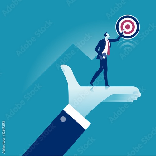 The manager‘s hand lifts the co-worker and helps him to achieve the goal