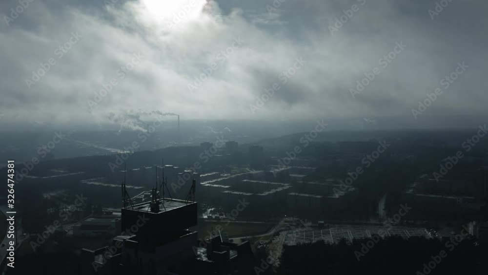 Urban industrial aerial panorama, smoke and fog at sunrise, big city Urban industrial aerial panorama, smoke and fog at sunrise, big city