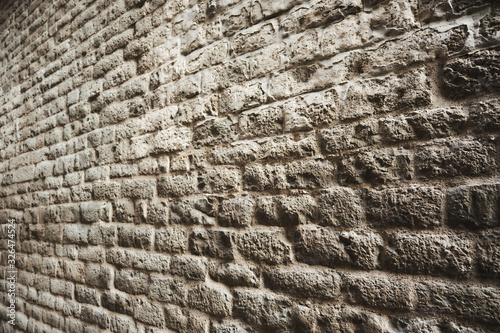 Wall background with hundreds of leaking rectangular stones