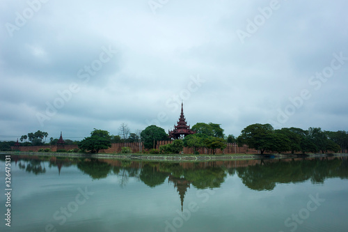 Mandalay Palace wall and moat under grey sky, Myanmar