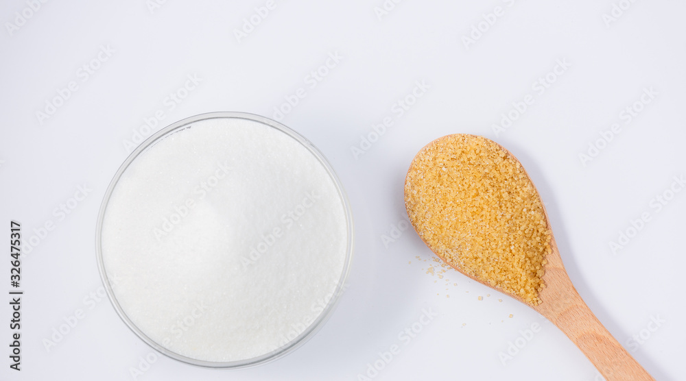 Brown sugar in a round glass cup on a white background, healthy sugar. Used for cooking or desserts. Brown sugar in a round glass cup on a white background, healthy sugar. Used for cooking or desserts.