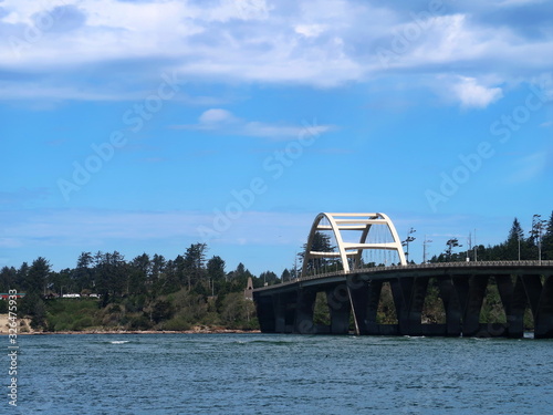 The Alsea Bay Bridge along coastal highway 101 connects Waldport and Bayshore on the Central Oregon Coast on a sunny spring day. © HDDA Photography 