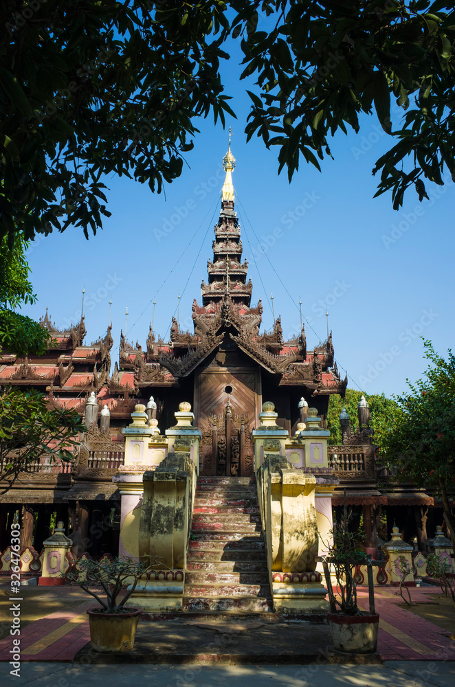 Shwe In Bin teak monastery with intricate detailed wood carving. Mandalay, Myanmar (Burma)