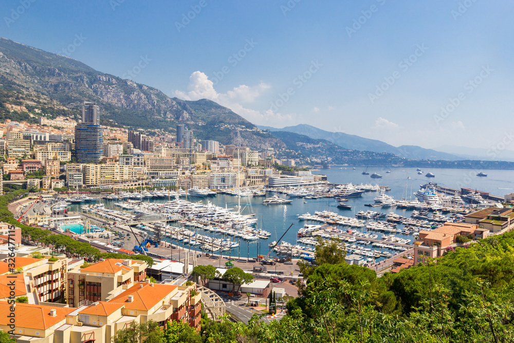 Panoramic view of Fontvieille and harbor with boats, luxury yachts in principality of Monaco, southern France