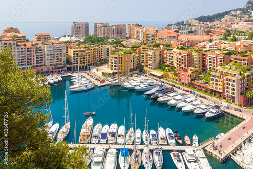 Panoramic view of Fontvieille and harbor with boats, luxury yachts in principality of Monaco, southern France