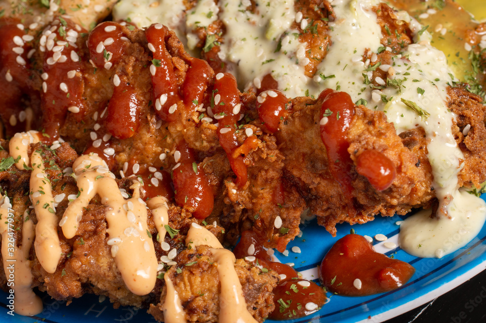 Crispy Fried chicken with sauces and spices 