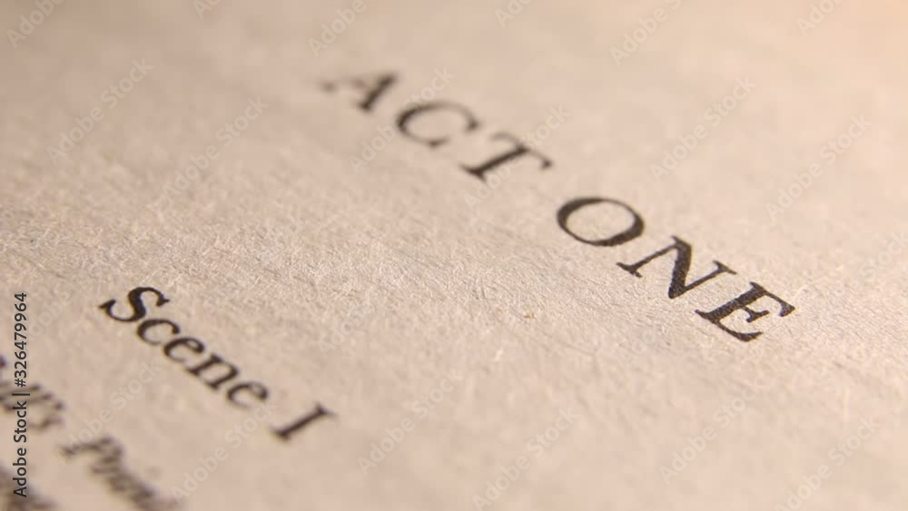 Close up of a book opening page act one curtain Close up of a book opening page act one curtain
