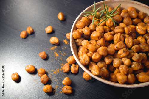 Healthy vegan crispy roasted chickpeas. Selective focus. photo