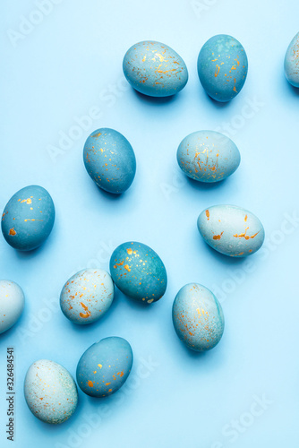 Easter background of eggs painted in blue color. Flat lay  top view.