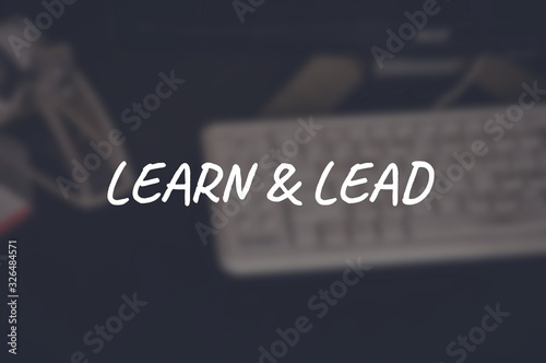 Learn and lead word with blurring business background