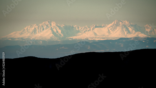 Fototapeta Naklejka Na Ścianę i Meble -  Temperature inversion in the mountains. The Tatra Mountains seen from the Bieszczady. Carpathians. Poland