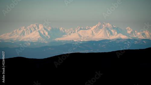 Fototapeta Naklejka Na Ścianę i Meble -  Temperature inversion in the mountains. The Tatra Mountains seen from the Bieszczady. Carpathians. Poland