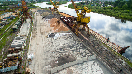 the cranes at the docks and river photo