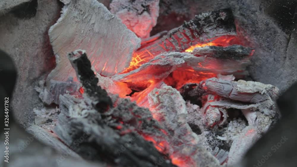 Static shot of bonfire embers slowly burning out the charcoal, close up shot. Static shot of bonfire embers slowly burning out the charcoal, close up shot.
