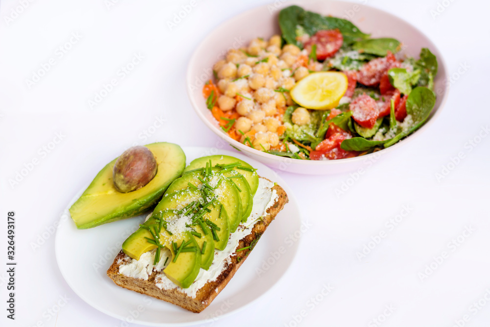 Avocado Salad with Cherry Tomatoes and Baby Spinach and Sandwich .Healthy Food Avocado Salad with Cherry Tomatoes and Baby Spinach and Sandwich .Healthy Food