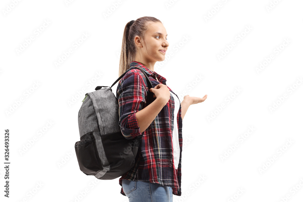 Teenage female student standing and gesturing with her hand Teenage female student standing and gesturing with her hand