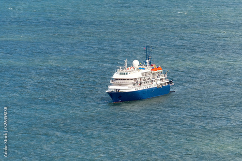 Blue cruise ship at sea. Passenger vessel. 