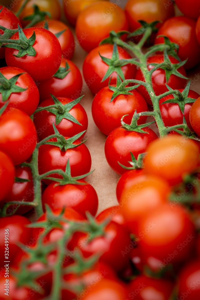 A full frame photograph of tomatoes for sale on a market stall