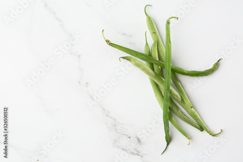 Green beans handful isolated on white background cutout. Fresh green beans Green Beans Pods. Slim isolated. cooking. close up of green aromatic herb for cooking.