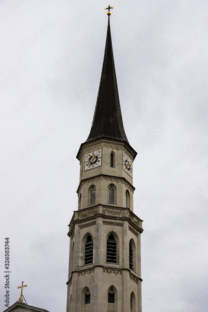 Beautiful white tower of an old stone church in Vienna, Austria.