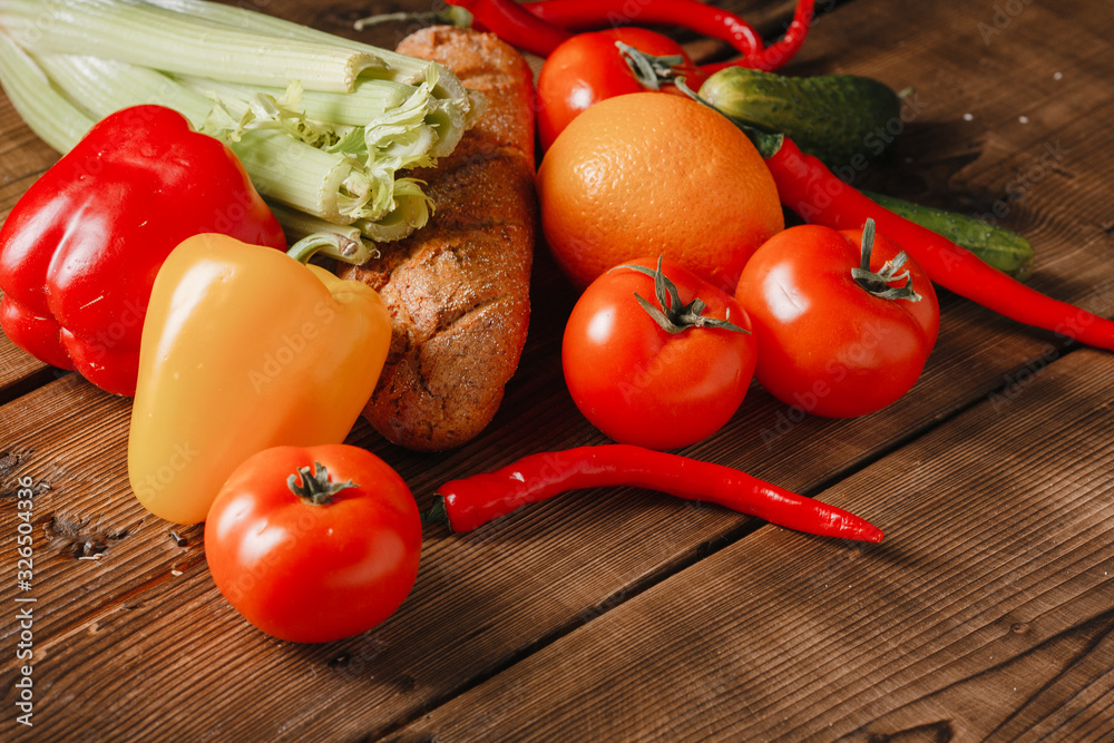 Fresh vegetables on brown wooden background. Isolated Fresh vegetables on brown wooden background. Isolated