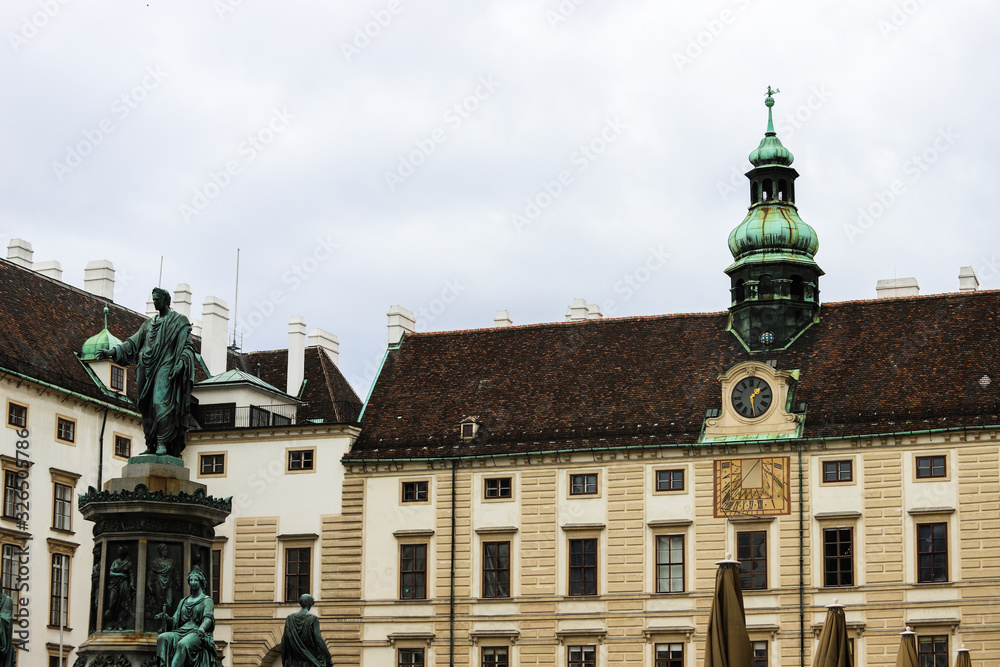Square with buildings and monument of Emperor Franz I of Austria in Vienna, Austria.