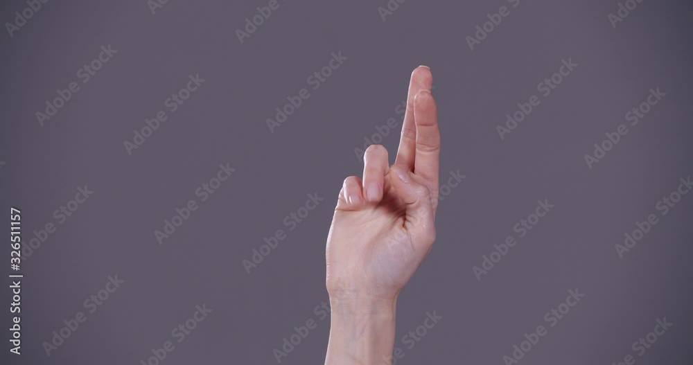 Woman showing R letter on grey background, closeup. Sign language