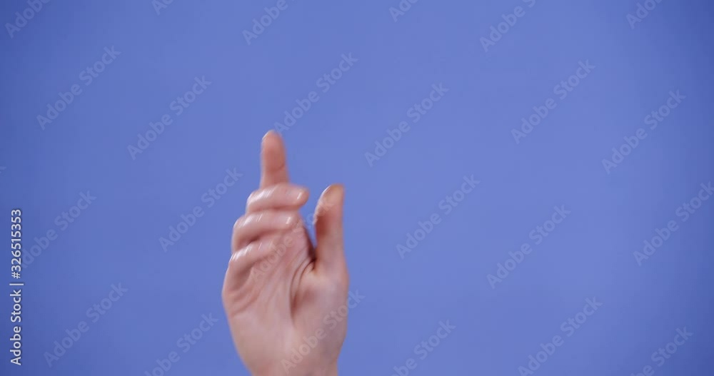 Woman showing B letter on blue background, closeup. Sign language Woman showing B letter on blue background, closeup. Sign language