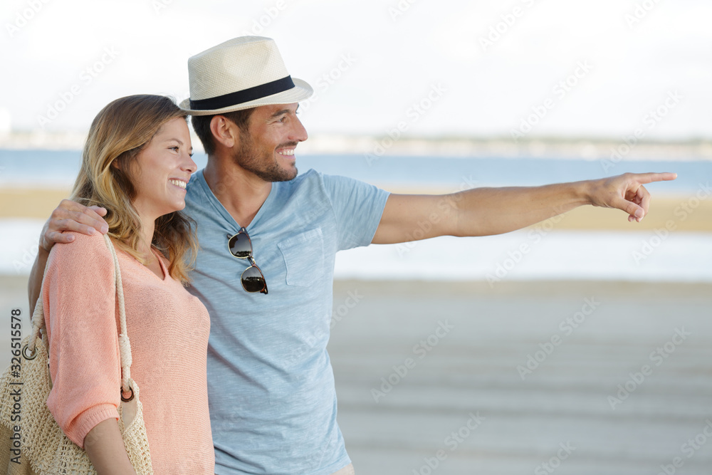 romantic young couple on the beachenjoying together