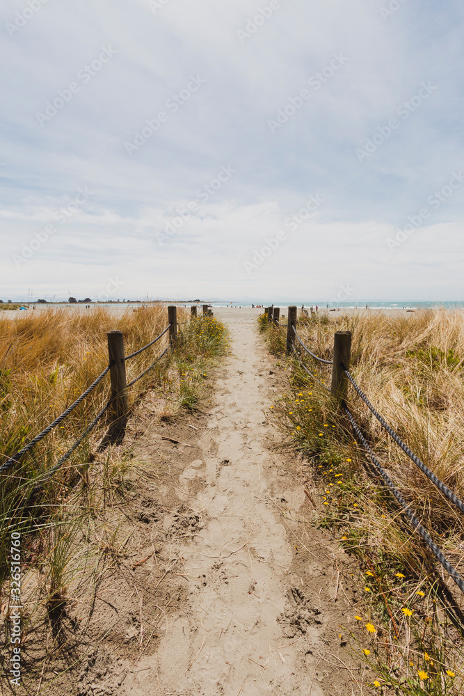 Path in sand to beach. Sand dunes. Walking on the beach sand.