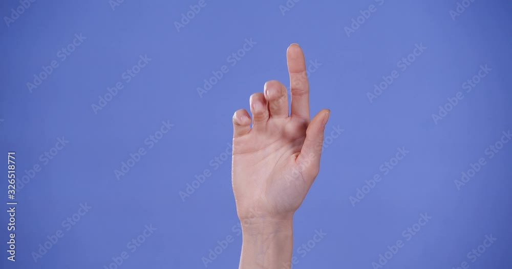 Woman showing L letter on blue background, closeup. Sign language Woman showing L letter on blue background, closeup. Sign language