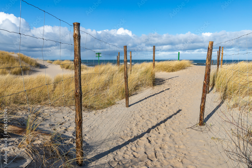 Path leading to the sea beach. Trail marked out by sea dunes. Path leading to the sea beach. Trail marked out by sea dunes.