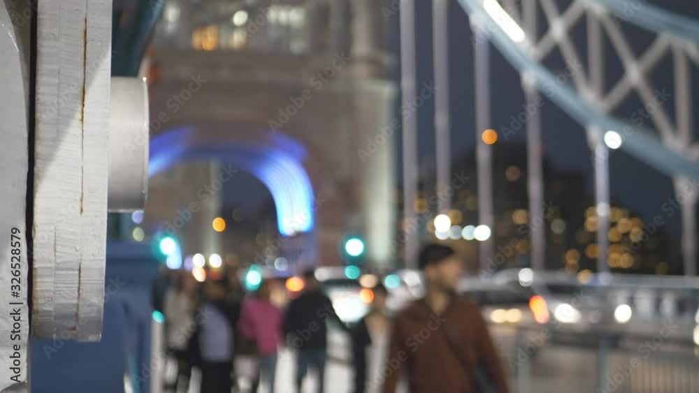 A close-up view of a suspension of the Tower Bridge at night. A close-up view of a suspension of the Tower Bridge at night.