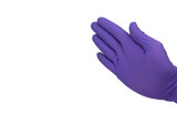 Hand in purple glove making 